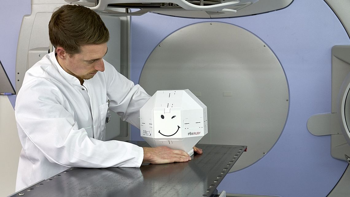 LINAC QA Daily accuracy checks of couch shifts: RUBY with LINAC QA insert and tilting base set up on patient couch with defined offset (red line)